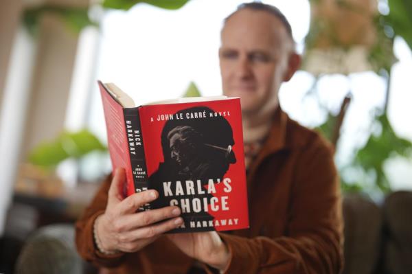 British author Nick Harkaway had been apprehensive a<em></em>bout being the one to co<em></em>ntinue his father's books. — AP
