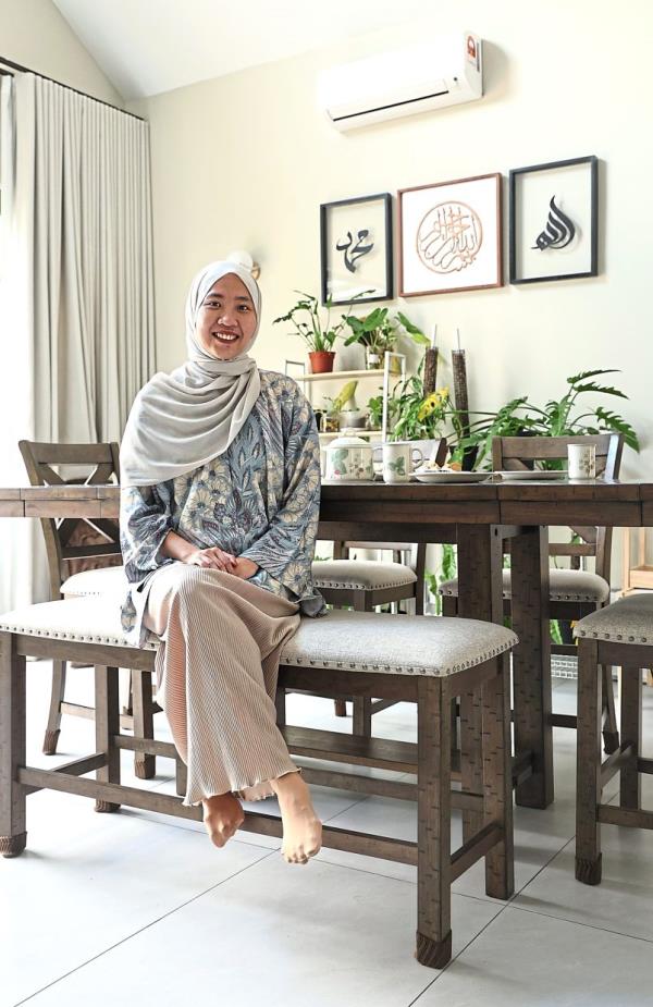 Homeowner Nadia sits proudly in her home that she envisio<em></em>ned more than a year ago.