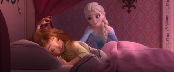 Anna asleep and Elsa leaning over her in a scene from Frozen