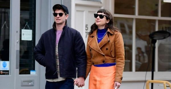 Andrew Garfield and Dr Kate Tomas holding hands 