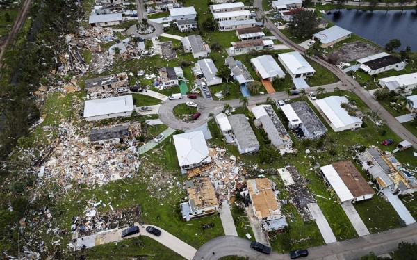 Aerial view of destroyed houses in Port St Lucie, Florida, after a tornado hit the area and caused severe damage as Hurricane Milton swept through Florida on October 11, 2024. - The death toll from Hurricane Milton rose to at least 16 on October 11, 2024, officials in Florida said, as residents began the painful process of piecing their lives and homes back together. Nearly 2.5 million households and businesses were still without power, and some areas in the path cut through the Sunshine State by the mo<em></em>nster storm from the Gulf of Mexico to the Atlantic Ocean remained flooded. (Photo by Miguel J. Rodriguez Carrillo / AFP)