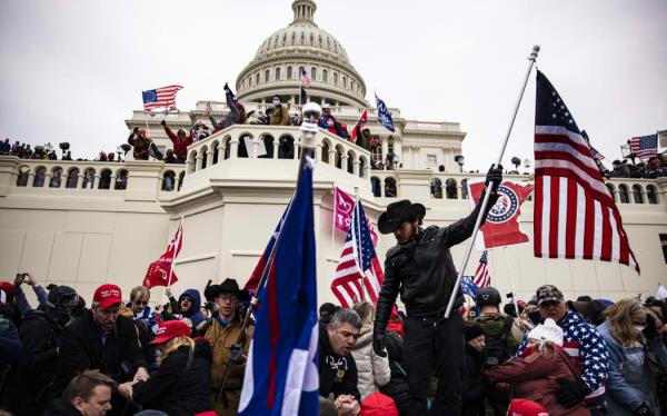 WASHINGTON, DC - JANUARY 06: Pro-Trump supporters storm the U.S. Capitol following a rally with President Donald Trump on January 6, 2021 in Washington, DC.