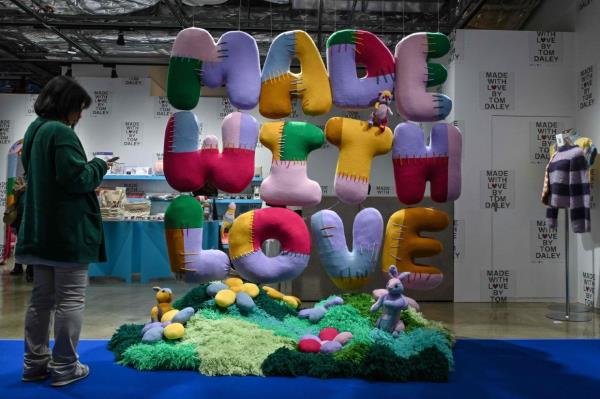 A new exhibition showcasing knitting creations made by retired British Olympic diving champion Tom Daley in Tokyo.