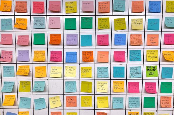 Post-it notes that are part of the Subway Therapy project are pictured at the 14th St/6th Ave station bypass in New York City.