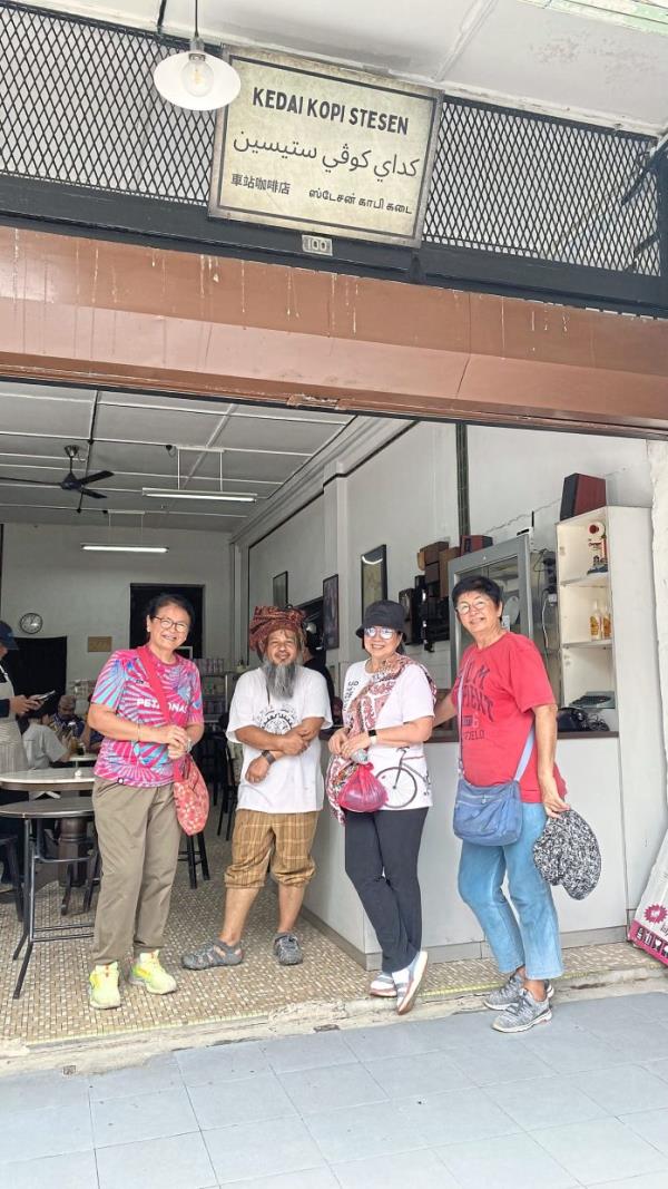 The travellers at a cafe in Kuala Lipis.