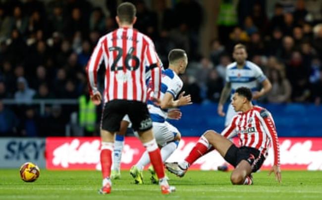 Jobe Bellingham commits the foul on QPR’s Zan Celar that earned him a red card.