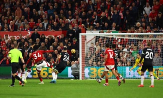 Ola Aina curls home Forest’s third goal.