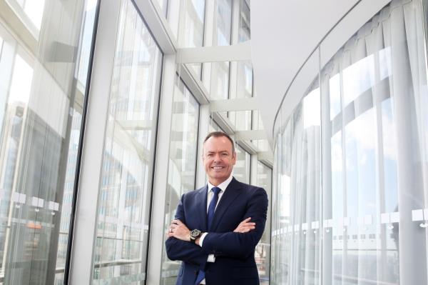 Do<em></em>nald 'Don' Meij, CEO of Domino's Pizza, posing in a suit and tie in Sydney, Australia