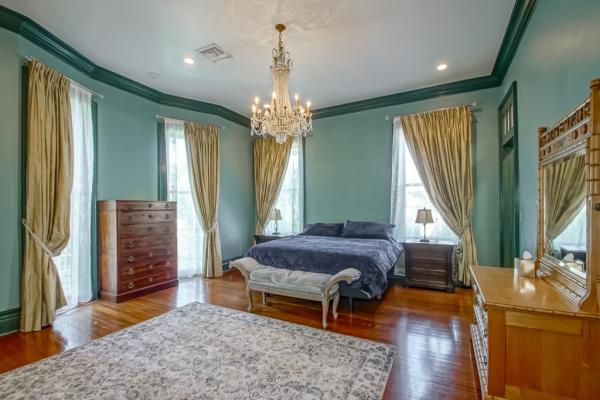 The main bedroom is calming with quiet color