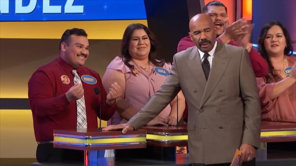 Steve Harvey with the Hernandez family on 