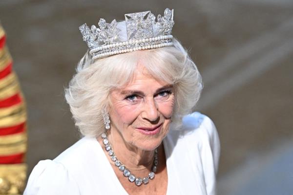Queen Camilla wearing a crown at the State Opening of Parliament in London