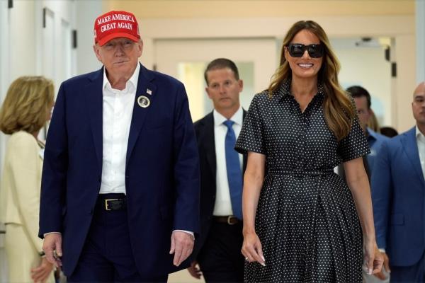 Do<em></em>nald Trump and former first lady Melania Trump walk after voting on Election Day at the Morton and Barbara Mandel Recreation Center, Tuesday, Nov. 5, 2024, in Palm Beach, Fla.