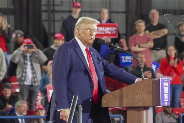 Supporters of Republican presidential nominee, former President Do<em></em>nald Trump's reelection events cheer for him during a campaign rally at the J.S. Dorton Arena on November 04, 2024 in Raleigh, North Carolina.