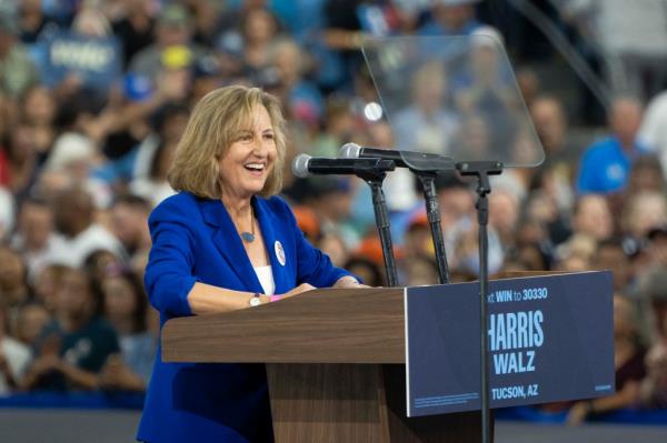 Democratic candidate Kirsten Engel speaking at podium during Get-Out-The-Vote rally alo<em></em>ngside former President Barack Obama, in support of Kamala Harris