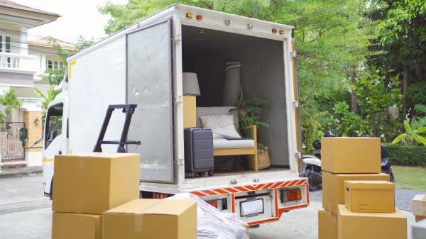A moving truck filled with boxes and furniture, transporting household items for relocation services