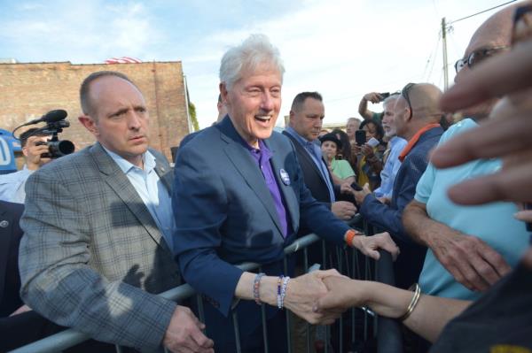 Bill Clinton greets supporters following a campaign event in Michigan on Wednesday.
