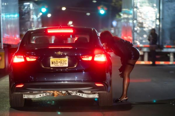 A prostitute soliciting a driver on Georgia Avenue