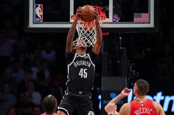 Nets guard Keon Johnson goes up for a dunk during the first half against the Bulls on Friday night at Barclays Center.