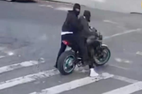 Footage released by the NYPD late Thursday shows the two masked suspects – accused of six robberies spanning from Oct. 8 to 22  – hopping on a single motorcycle with green rims and speeding off. 