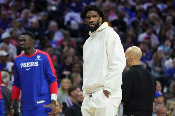 Joel Embiid #21 of the Philadelphia 76ers looks on during a timeout against the Milwaukee Bucks in the first half at the Wells Fargo Center on October 23, 2024 in Philadelphia, Pennsylvania.