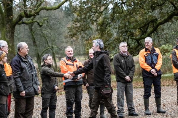 Danish King Frederik and a group of men, including celebrities Michel de Rosen, O. Henry, Peter Jukes, Marie Carmen, Mariano Martinez, and Lorraine Crapp, enjoying a Royal Hunt in Gludsted Plantation, Denmark.