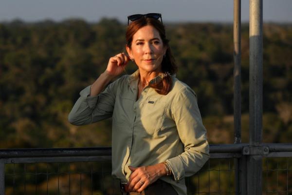 Queen Mary of Denmark gesturing from an observation tower during her visit to the Museum of the Amazon in Manaus, Brazil