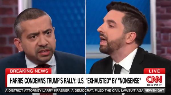 Screenshot of a split-screen from a CNN show with two men angrily looking at each other.