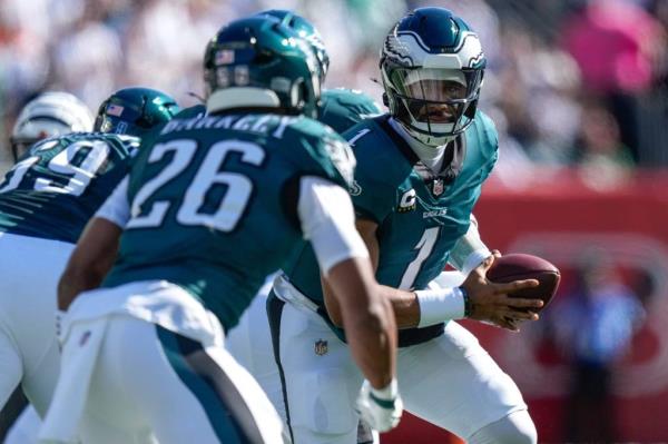 The reported deal being discussed would value the Eagles at north of $8 billion. The image above shows quarterback Jalen Hurts and running back Saquon Barkley.
