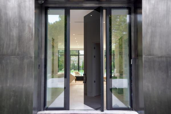 Oxidized stainless steel door by an artisan make a statement. 