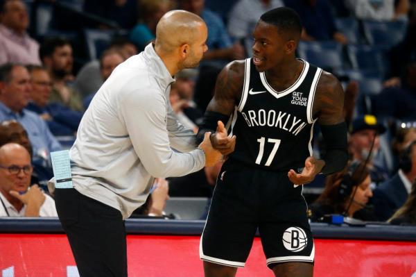 Dennis Schroder (R.) speaks with Jordi Fernandez during the Nets' win over the Grizzlies on Oct. 30, 2024. 
