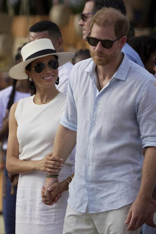 Prince Harry and Meghan Markle holding hands upon their arrival in San Basilio de Palenque, Colombia, in August 2024.