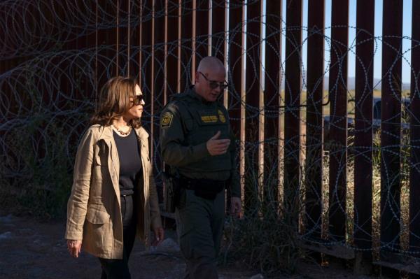 Vice President Kamala Harris walks alo<em></em>ngside the border wall in Arizona with the Tucson sector border chief.