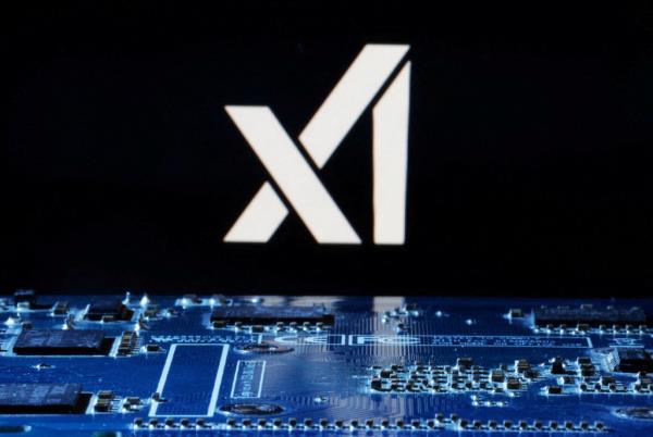 xAI logo near computer motherboard.