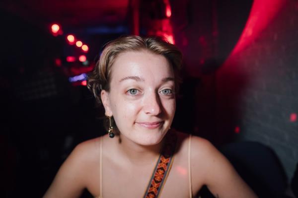 Row Kiefer wearing earplug earrings at a loud bar, The Bush Bar, in Brooklyn, NY; photo by Stefano Giovannini