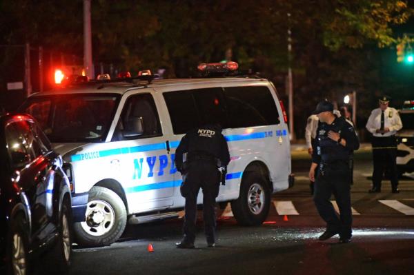 The NYPD investigates the scene wher<em></em>e an officer was struck by a car before another cop opened fire in Brooklyn, NY on Oct. 29, 2024.