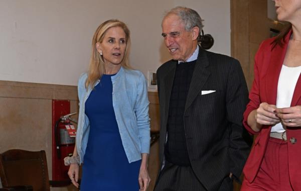 Stephanie Foster and her legal advisor Lanny Davis standing outside a Manhattan courtroom