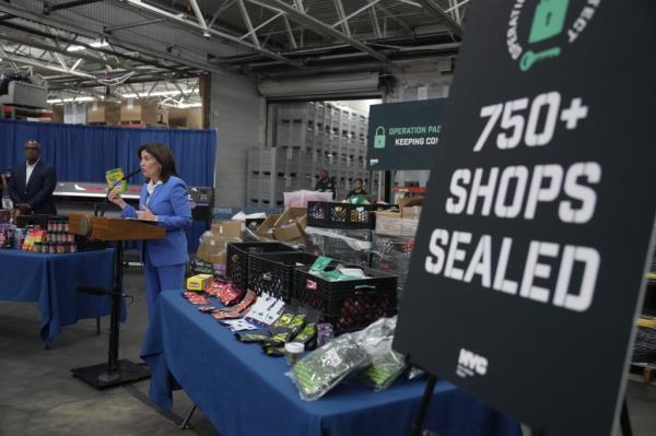 Kathy Hochul next to illegal weed products