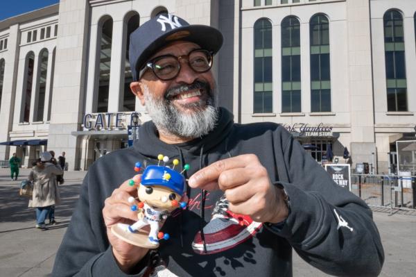 Eduardo Perez sticks the doll.