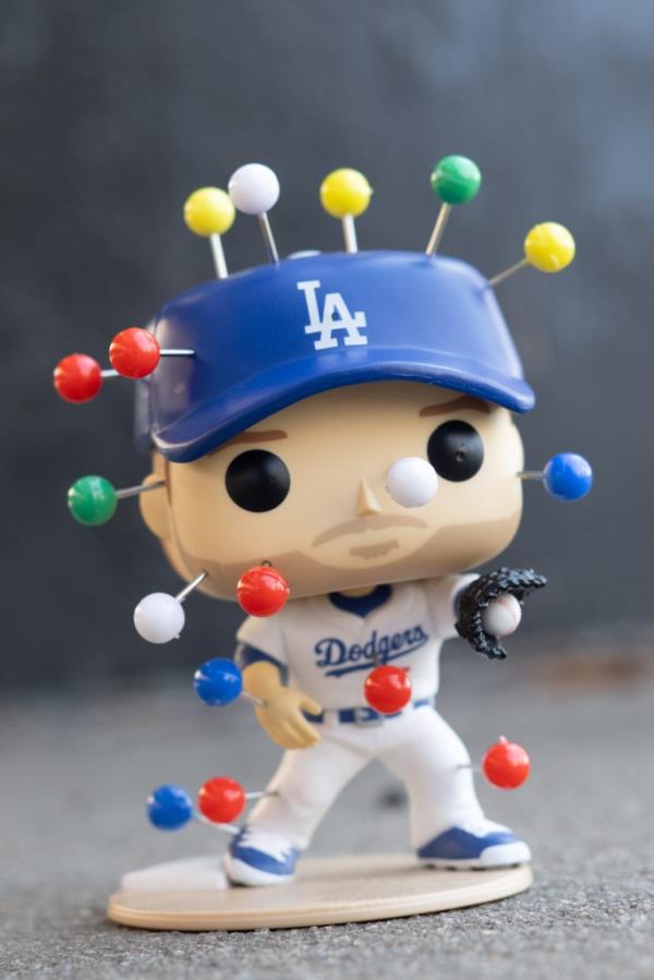 The pushpin-covered doll.