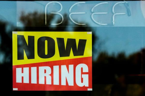 Hiring sign in restaurant window on Oct. 20, 2024.