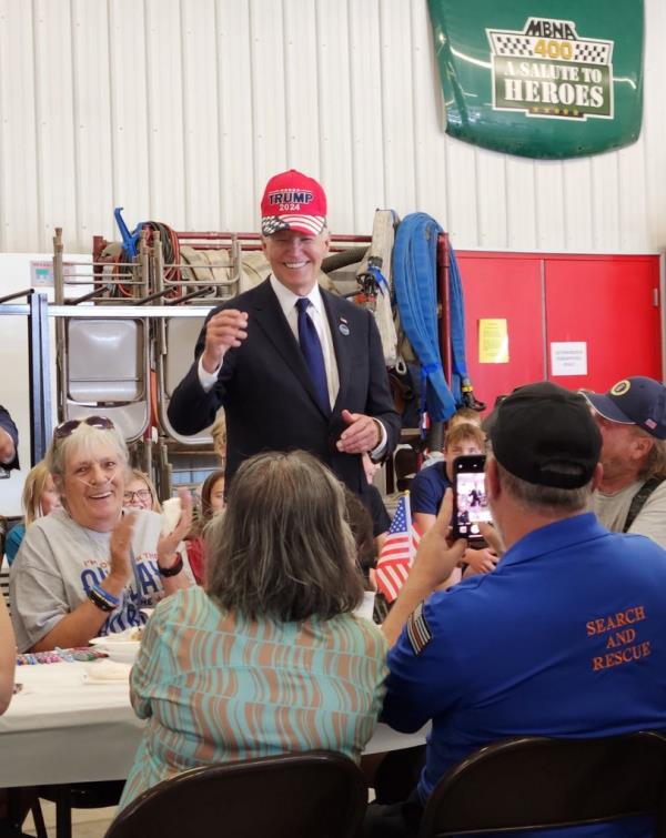 Joe Biden wearing a Trump hat while speaking to volunteer firefighters at the Shanksville Volunteer Fire Department on September 11, 2024