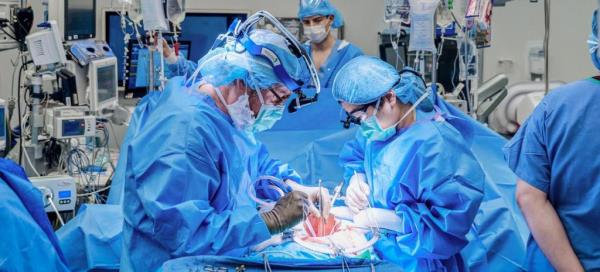 A group of surgeons, including Dr. Robert Montgomery, performing surgery
