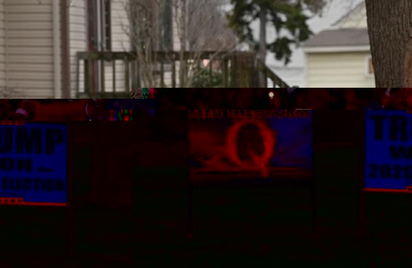 Trump signs and even the some signs that promote QAnon in Sterling Heights, Michigan on April 11, 2022.