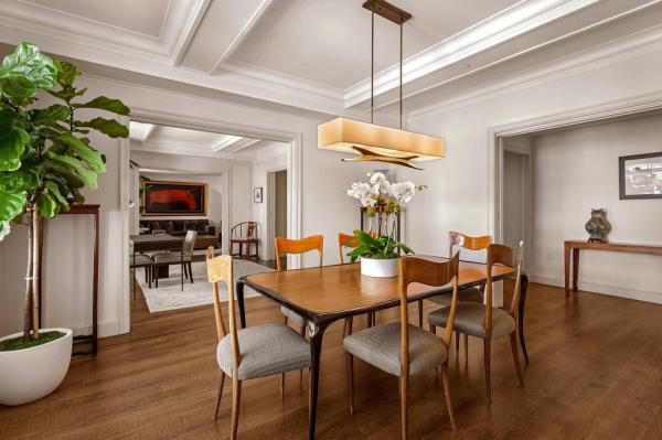 A three-bedroom residence in the Mark Hotel, Upper East Side, featuring a dining table with chairs.