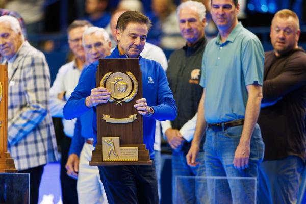 Former Kentucky Wildcats head coach and current St. John's head coach Rick Pitino brings out the 1996 NCAA Division I Natio<em></em>nal Champio<em></em>nship trophy during Big Blue Madness at Rupp Arena at Central Bank Center.