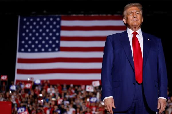 Republican presidential nominee, former U.S. President Do<em></em>nald Trump arrives to speak during a campaign rally at Suburban Collection Showplace on October 26, 2024 in Novi, Michigan.