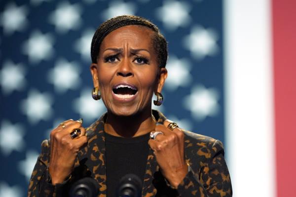 Former first lady Michelle Obama speaks at a campaign rally for democratic presidential nominee Vice President Kamala Harris at the Wings Event Center, in Kalamazoo, Mich.