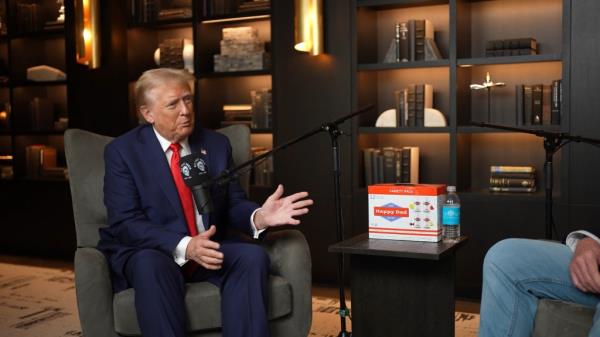 Do<em></em>nald Trump in a suit, sitting with a microphone, discussing his unexpected rapport with Hollywood actor Dwayne 'The Rock' Johnson