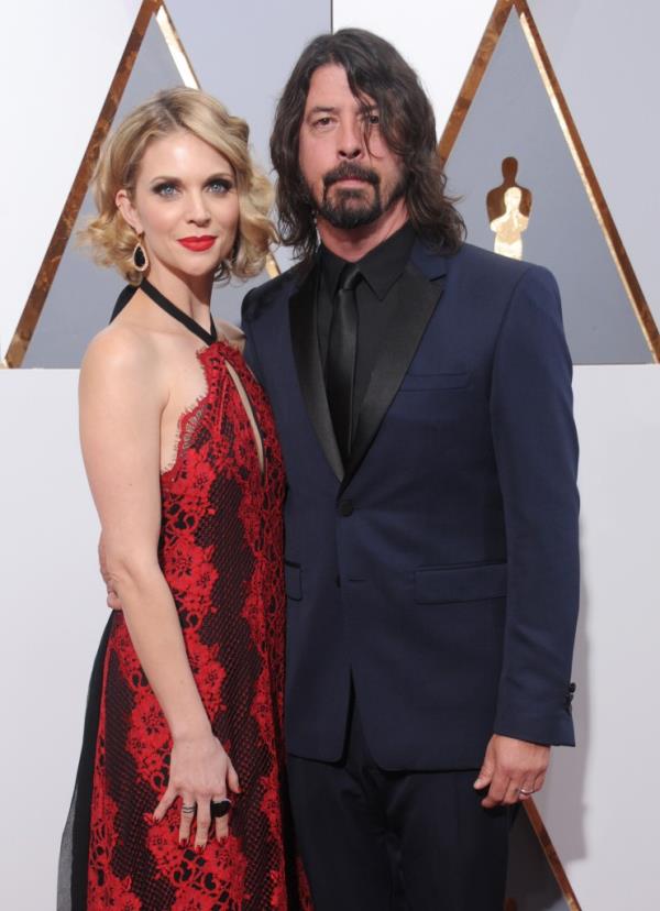 Musician Dave Grohl and wife Jordyn Blum arrive at the 88th Annual Academy Awards at Hollywood & Highland Center on February 28, 2016 in Hollywood, California.