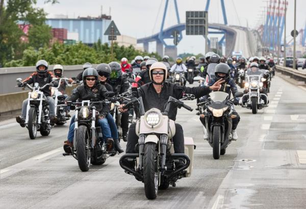 Bikers ride across bridge during Hamburg Harley Days Parade.